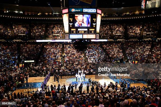 Kobe Bryant of the Los Angeles Lakers is seen on the Amway Arena scoreboard screen as he listens to the National Anthem prior to playing against the...