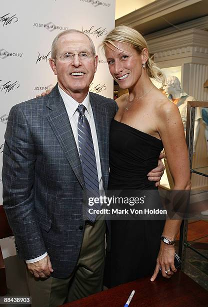 New York Giants Coach Tom Coughlin and VP Marketing/PR for Joseph Abboud, Trudy Larson pose for a photo at the dress to win event hosted by Joseph...