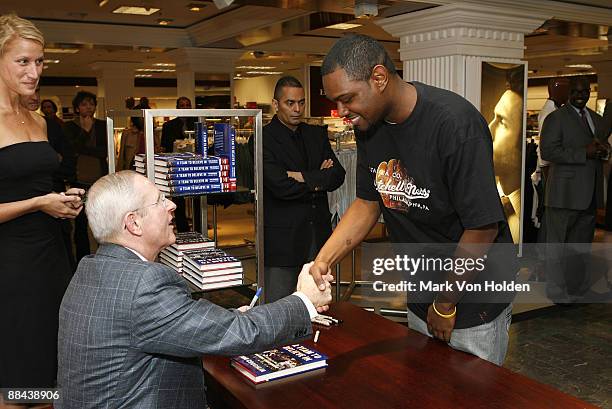 New York Giants Coach Tom Coughlin meets a fan at the dress to win event hosted by Joseph Abboud and Lord & Taylor at Lord And Taylor on June 11,...