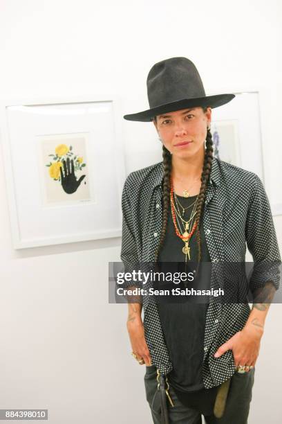 Artist Tasya van Ree poses in front of her artwork at OptiMystic: A Brandon Boyd Pop Up Gallery Featuring He, Tasya Van Ree, Natalie Bergman, Diana...