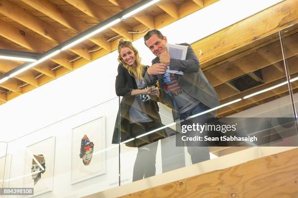 Actor Josh Brolin and wife Kathryn Boyd pose in front of a Brandon Boyd artwork while at OptiMystic: A Brandon Boyd Pop Up Gallery Featuring He,...