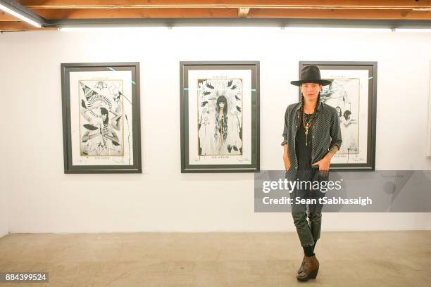 Artist Tasya van Ree poses in front of her artwork at OptiMystic: A Brandon Boyd Pop Up Gallery Featuring He, Tasya Van Ree, Natalie Bergman, Diana...