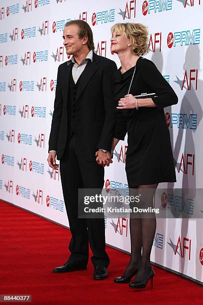 Actor Jesse Johnson and actress Melanie Griffith arrive at AFI Lifetime Achievement Award: A Tribute to Michael Douglas held at Sony Pictures Studios...