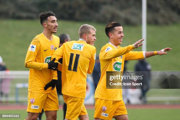 Yanis Barka, Alexis Busin and Amine Bassi of Nancy celebrate during the French Cup match between Rungis and Nancy on December 2, 2017 in...