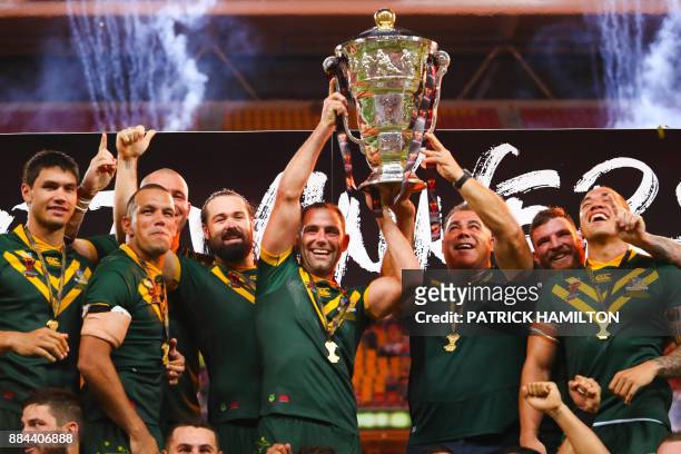 Australian team member's celebrate their victory in the Rugby League World Cup men's final match between Australia and England in Brisbane on...