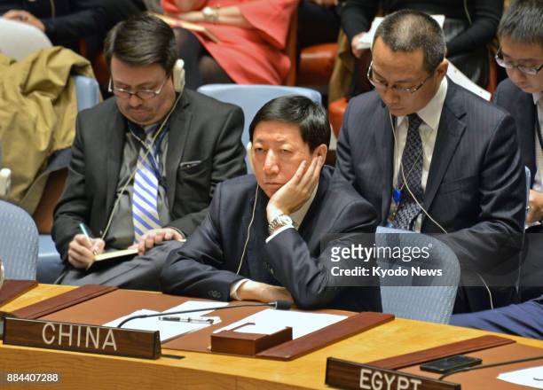 Chinese Deputy Ambassador to the United Nations Wu Haitao attends an emergency meeting of the world body's Security Council in New York on Nov. 29 in...