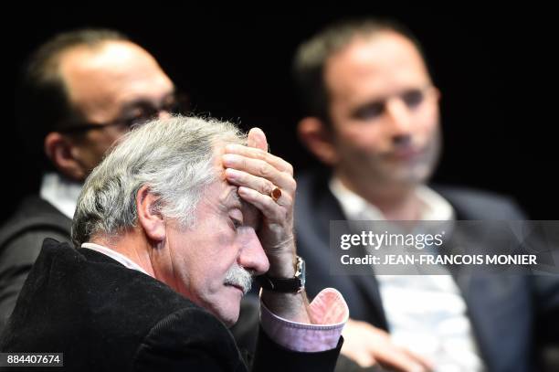 Member of the Parliament from the Ecologist group Noel Mamere reacts next to Benoit Hamon during the founding congress of Hamon's left-wing mouvement...