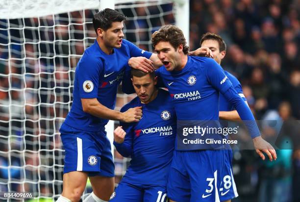 Eden Hazard of Chelsea celebrates after scoring his sides third goal with Alvaro Morata of Chelsea and Marcos Alonso of Chelsea during the Premier...