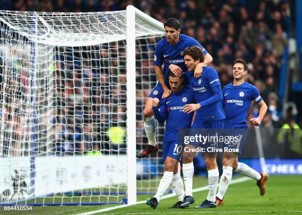 Eden Hazard of Chelsea celebrates after scoring his sides third goal with Alvaro Morata of Chelsea and Marcos Alonso of Chelsea during the Premier...