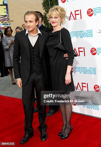 Actors Jesse Johnson and Actress Melanie Griffith arrive at AFI Lifetime Achievement Award: A Tribute to Michael Douglas held at Sony Pictures...