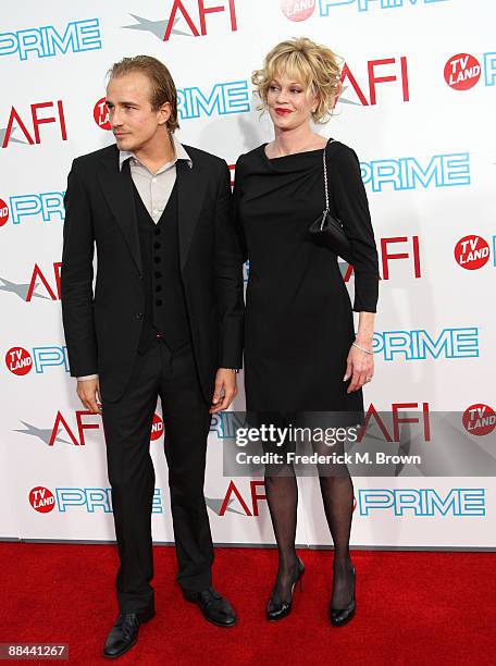 Actors Jesse Johnson and Actress Melanie Griffith arrive at AFI Lifetime Achievement Award: A Tribute to Michael Douglas held at Sony Pictures...