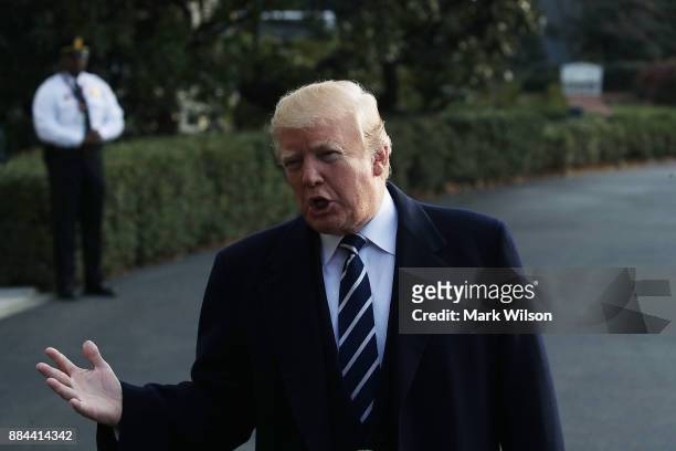 President Donald Trump speaks to the media before departing the White House on Marine One, on December 2, 2017 in Washington, DC. U.S. President...