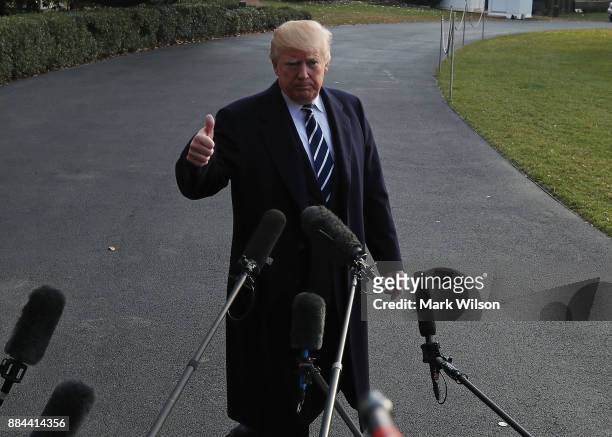 President Donald Trump speaks to the media before departing the White House on Marine One, on December 2, 2017 in Washington, DC. Later today U.S....