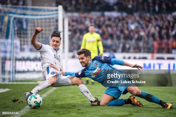 Marcel Mehlem of Karlsruhe and Maximilian Welzmueller of Aalen fight for the ball during the 3. Liga match between Karlsruher SC and VfR Aalen at...