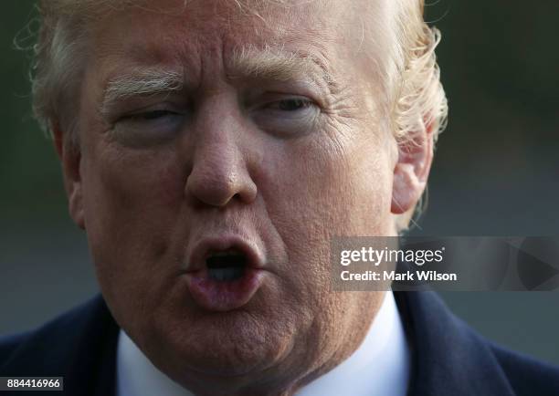 President Donald Trump speaks to the media before departing the White House on Marine One, on December 2, 2017 in Washington, DC. U.S. President...