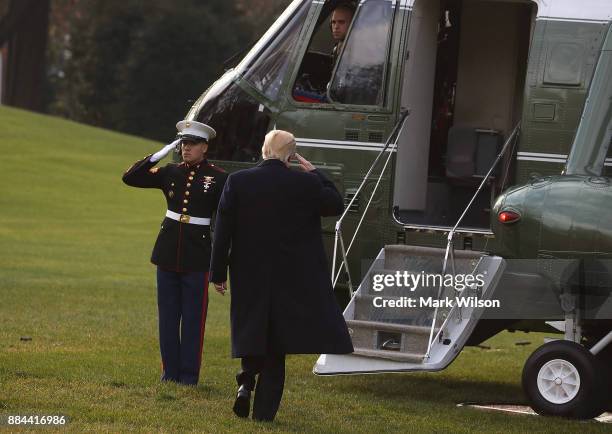 President Donald Trump prepares to board Marine One, on December 2, 2017 in Washington, DC. Later today U.S. President Donald Trump is traveling to...