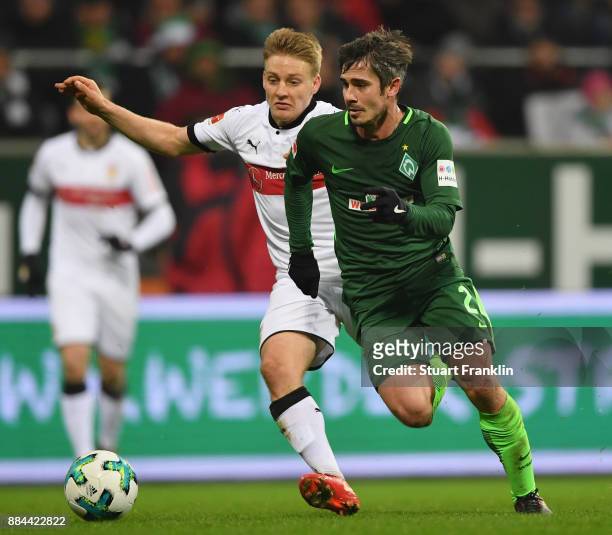 Fin Bartels of Bremen is challenged by Santiago Ascacibar of Stuttgart during the Bundesliga match between SV Werder Bremen and VfB Stuttgart at...