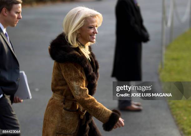 White House counselor Kellyanne Conway walks towards Marine One, during US President Donald Trump departure at the White House in Washington, DC, on...