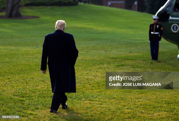 President Donald Trump walks towards Marine One before departing at the White House in Washington, DC, on December 2 en route to Joint Base Andrews....