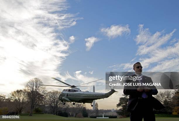 Marine One with US President Donald Trump aboard departs at the White House in Washington, DC, on December 2 en route to Joint Base Andrews. Trump...