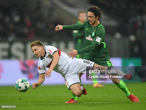 Thomas Delaney of Bremen is challenged by Santiago Ascacibar of Stuttgart during the Bundesliga match between SV Werder Bremen and VfB Stuttgart at...