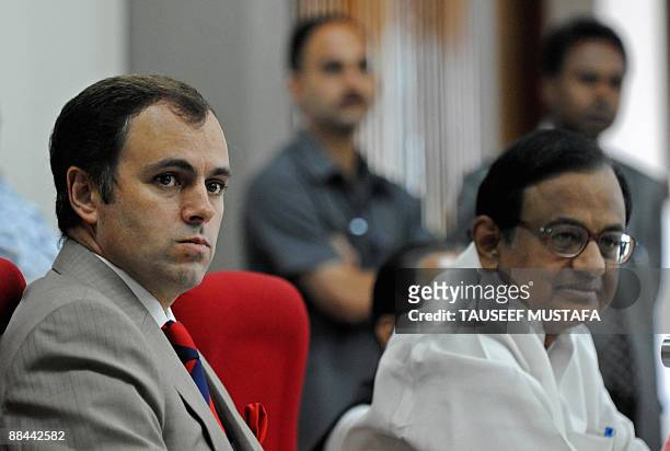 Jammu and Kashmir Chief Minister Omar Abdullah and Indian Home Minister P.Chidambram listen during a press conference in Srinagar on June 12, 2009....