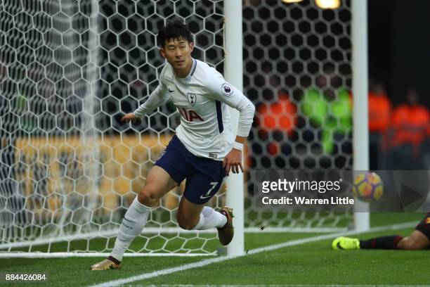 Heung-Min Son of Tottenham Hotspur celebrates as he scores their first goal during the Premier League match between Watford and Tottenham Hotspur at...