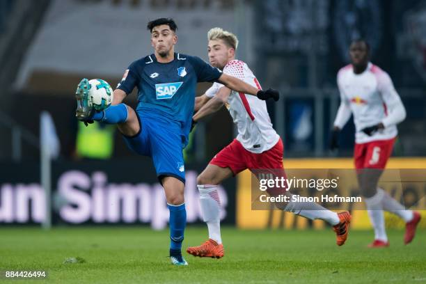 Nadiem Amiri of Hoffenheim is challenged by Kevin Kampl of Leipzig during the Bundesliga match between TSG 1899 Hoffenheim and RB Leipzig at Wirsol...