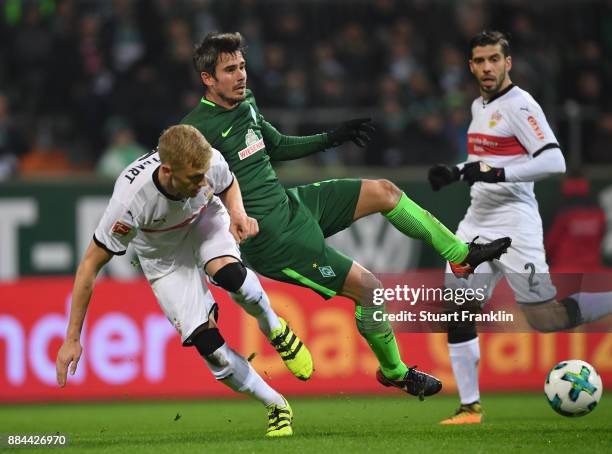 Fin Bartels of Bremen is challenged by Santiago Ascacibar of Stuttgart during the Bundesliga match between SV Werder Bremen and VfB Stuttgart at...