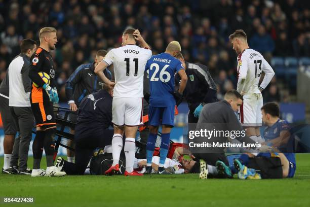 Robbie Brady of Burnley receives treatment from the medical team during the Premier League match between Leicester City and Burnley at The King Power...