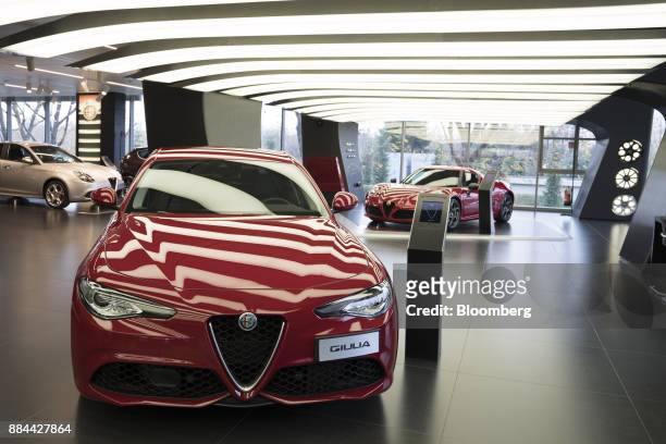 Giulia Guadrifoglio automobile, produced by Fiat Chrysler Automobiles NV, sits on display at the Alfa Romeo Museum in Arese, Italy, on Saturday, Dec....