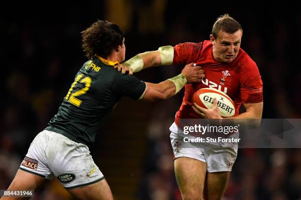 Hadleigh Parkes of Wales is tackled by Francois Venter of South Africa during the international match match between Wales and South Africa at...