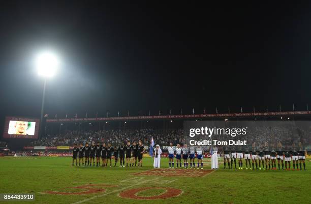 Both teams line up for the national anthems during the Cup Final match between South Africa and New Zealand on Day Three of the Emirates Dubai Rugby...