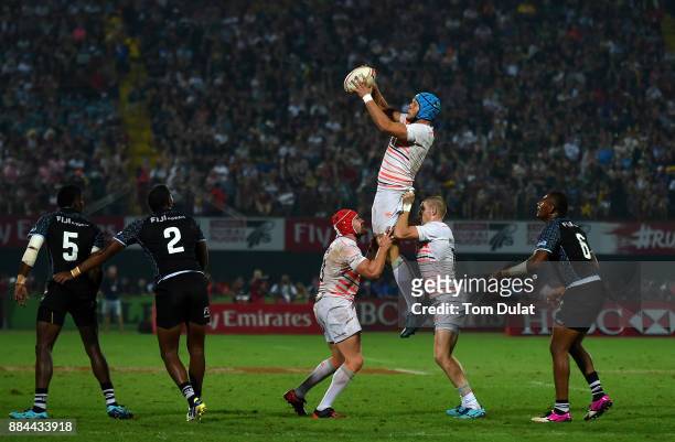 Richard de Carpentier of England wins the lineout ball during the Bronze Medal Final match between Fiji and England on Day Three of the Emirates...
