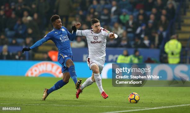 Burnley's Stephen Ward and Leicester City's Demarai Gray during the Premier League match between Leicester City and Burnley at The King Power Stadium...