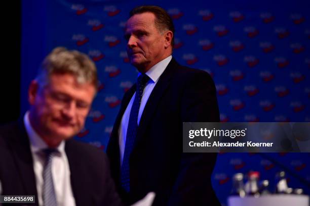 Georg Pazderski of the right-wing Alternative for Germany walks by Joerg Meuthen during the AfD federal congress at the Hannover Congress Centrum on...