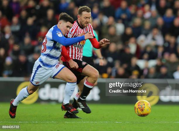 Aiden McGeady of Sunderland competes with Liam Kelly of Reading during the Sky Bet Championship match between Sunderland and Reading at Stadium of...