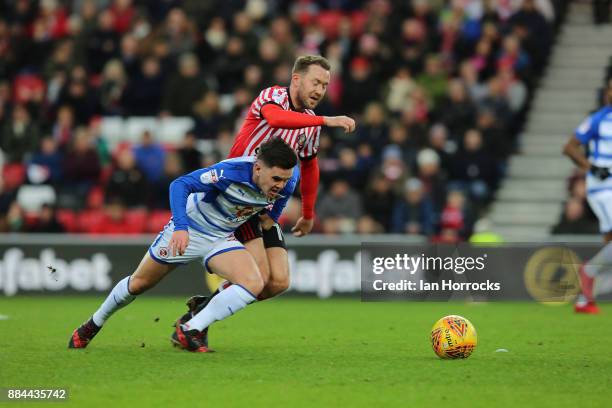 Aiden McGeady of Sunderland competes with Liam Kelly of Reading during the Sky Bet Championship match between Sunderland and Reading at Stadium of...