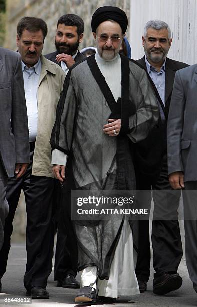 Former Iranian president Mohammad Khatami arrives to cast his vote at Jamaran mosque polling station in Tehran on June 12, 2009. Iranians poured into...