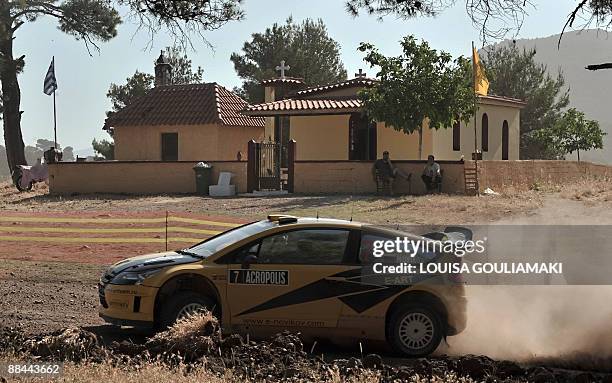 Russians Evgeny Novikov and Dale Moscatt drive their Citroen C4 on June 12, 2009 during a special stage on the first day of the WRC Acropolis Rally...