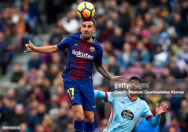 Paco Alcacer of Barcelona competes for the ball with Facundo Roncaglia of Celta during the La Liga match between Barcelona and Celta de Vigo at Camp...