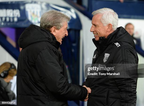 Roy Hodgson, Manager of Crystal Palace and Alan Pardew, Manager of West Bromwich Albion embrace prior to the Premier League match between West...