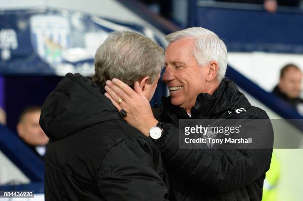 Roy Hodgson, Manager of Crystal Palace and Alan Pardew, Manager of West Bromwich Albion embrace prior to the Premier League match between West...