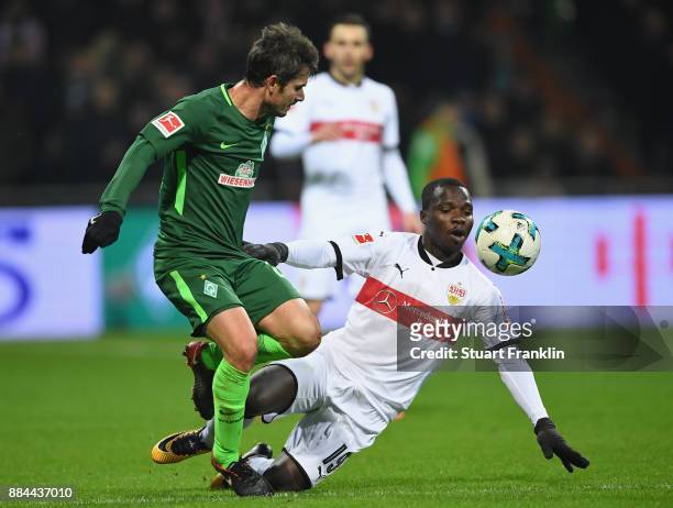Fin Bartels of Bremen is challenged by Chadrac Akolo of Stuttgart during the Bundesliga match between SV Werder Bremen and VfB Stuttgart at...