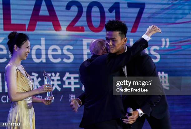 President Julio Cesar Maglione and Chinese swimmer Sun Yang attend the 2017 FINA/Alisports World Aquatics Gala "Soiree des Etoiles"on December 2,...