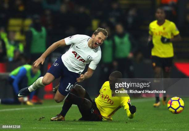 Christian Kabasele of Watford fouls Harry Kane of Tottenham Hotspur during the Premier League match between Watford and Tottenham Hotspur at Vicarage...