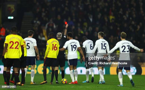Davinson Sanchez of Tottenham Hotspur is shown a red card by referee Martin Atkinson during the Premier League match between Watford and Tottenham...