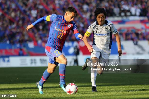 Yuhei Tokunaga of FC Tokyo and Yasuhito Endo of Gamba Osaka compete for the ball during the J.League J1 match between FC Tokyo and Gamba Osaka at...