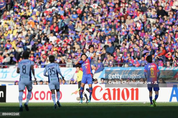 Yasuhito Endo of Gamba Osaka and Kosuke Ota of FC Tokyo compete for the ball during the J.League J1 match between FC Tokyo and Gamba Osaka at...
