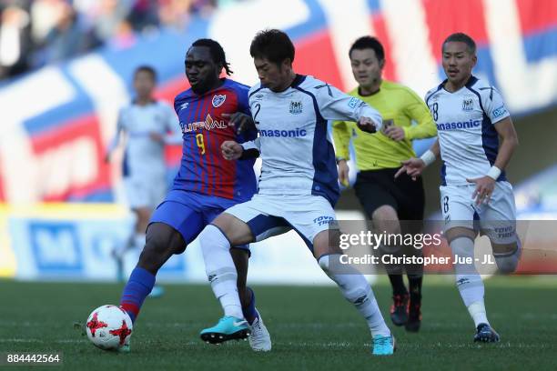 Peter Utaka of FC Tokyo and Genta Miura of Gamba Osaka compete for the ball during the J.League J1 match between FC Tokyo and Gamba Osaka at...